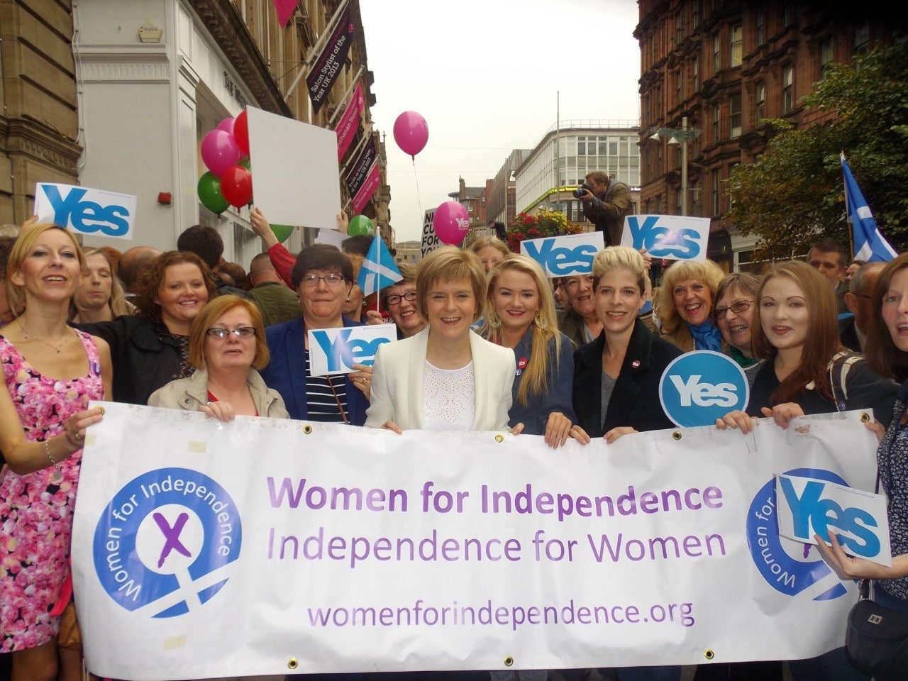 group of women holding WFI flag
