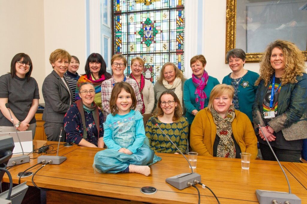 A group of women and girls meeting for International Women's Day 2019